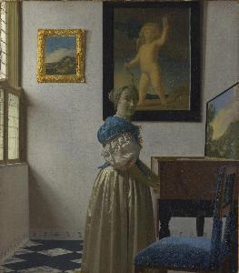 Johannes Vermeer - A Lady Standing at a Virginal